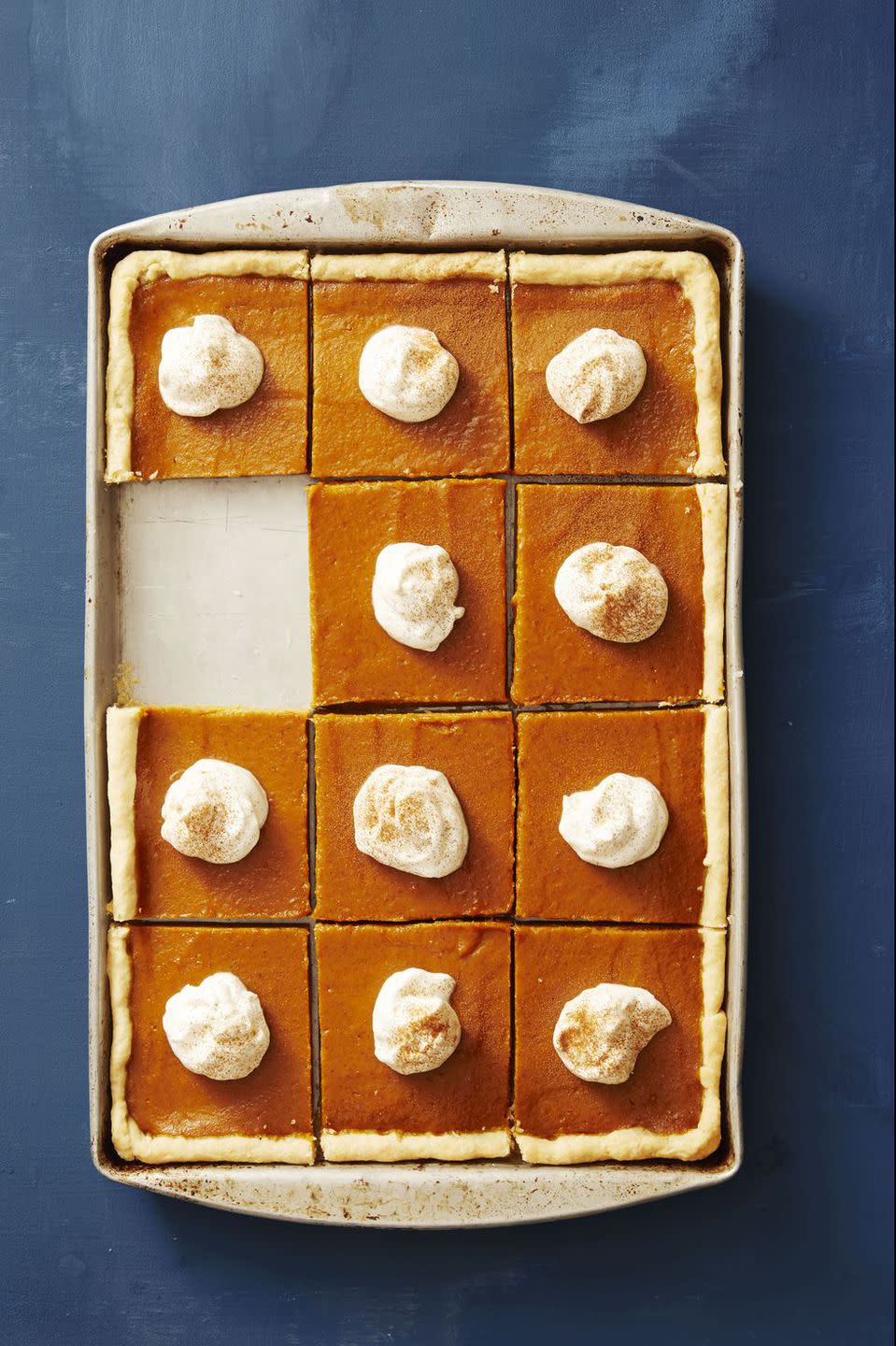 <p>Skip the standard circle pie and serve <a rel="nofollow noopener" href="https://www.redbookmag.com/food-recipes/g2984/best-pumpkin-pie-recipes/" target="_blank" data-ylk="slk:this seasonal favorite;elm:context_link;itc:0;sec:content-canvas" class="link ">this seasonal favorite</a> on a baking sheet instead. Not only will you get more slices, but people can decide once and for all if they're a corner or non-corner type of person.</p><p><strong>Get the recipe at <a rel="nofollow noopener" href="https://www.goodhousekeeping.com/food-recipes/a41084/pumpkin-slab-pie-recipe/" target="_blank" data-ylk="slk:Good Housekeeping;elm:context_link;itc:0;sec:content-canvas" class="link ">Good Housekeeping</a>. </strong></p>