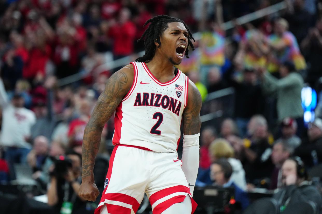 Arizona Wildcats guard Caleb Love (2) celebrates against the Southern California Trojans in the second half at T-Mobile Arena.