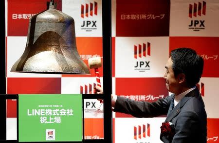 Line Corp. CEO Takeshi Idezawa rings a bell during a ceremony to mark the company's debut on the Tokyo Stock Exchange in Tokyo, Japan July 15, 2016. REUTERS/Issei Kato