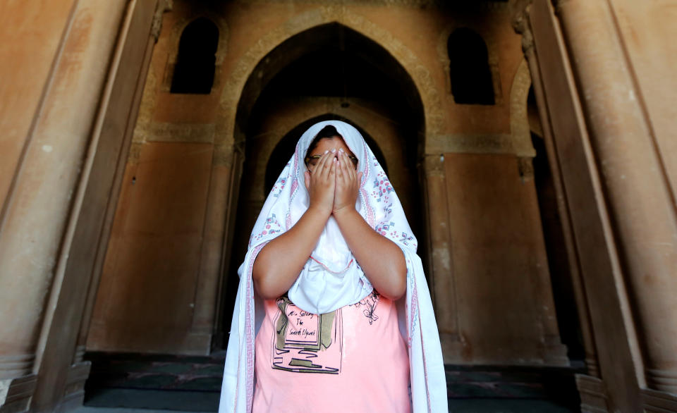 A girl prays during the first Friday of the holy month of Ramadan at Ibn Tulun Mosque in old Cairo, Egypt June 2, 2017. REUTERS/Amr Abdallah Dalsh