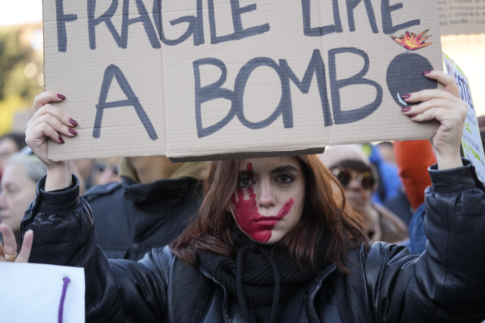 A woman shows a banner during a demonstration on the occasion of International Day for the Elimination of Violence against Women, in Milan, Italy, Saturday, Nov.25, 2023. Thousands of people are expected to take the streets in Rome and other major Italian cities as part of what organizers call a "revolution" under way in Italians' approach to violence against women, a few days after the horrifying killing of a college student allegedly by her resentful ex-boyfriend sparked an outcry over the country's "patriarchal" culture. (AP Photo/Luca Bruno)