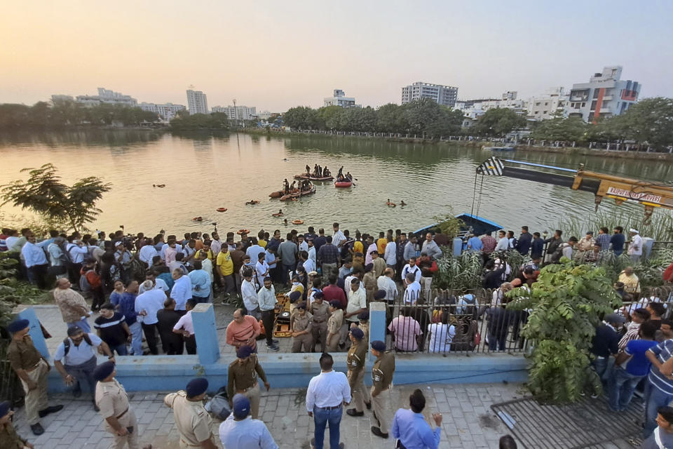 Rescuers look for missing children and teachers after a boat carrying 27 school children and their teachers capsized in Harni Lake in Vadodara, India, Thursday, Jan. 18, 2024. (AP Photo)