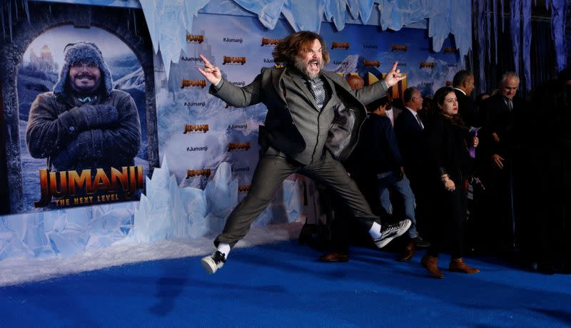 Cast member Black jumps at the premiere for the film "Jumanji: The Next Level" in Los Angeles