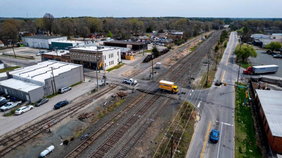 Traffic crosses the Driver Street rail crossing in Durham on March 22, 2024. A man was killed March 14 when he tried to cross the tracks between East Pettigrew Street, right, and East Peabody Street and became stuck between the crossing arms.