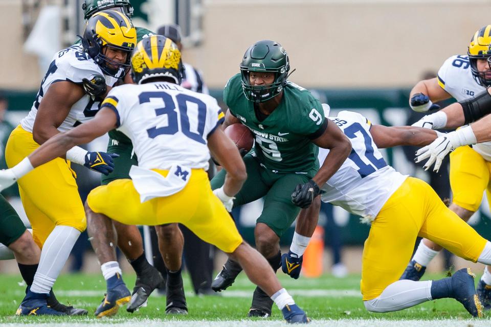 Michigan State's Kenneth Walker gouged Michigan for 8.6 yards per carry.