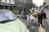 People attend a PARK(ing) Day event in Riga, September 20, 2013. (REUTERS/Ints Kalnins)