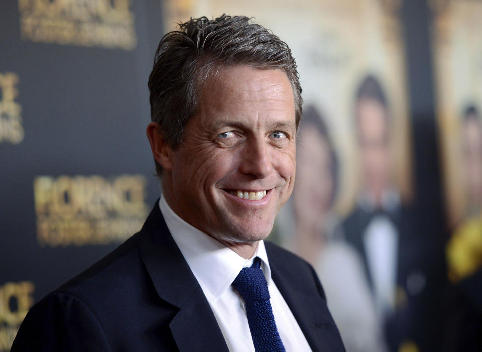 FILE - This Aug. 9, 2016 file photo shows actor Hugh Grant at the premiere of "Florence Foster Jenkins" in New York. Grant will be among several cast members from the 2003 film, "Love Actually," returning for a 10-minute reunion film airing as part of Comic Relief’s “Red Nose Day Special” on NBC in May. (Photo by Evan Agostini/Invision/AP, File)