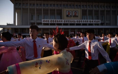 Students dance on Tuesday to mark the anniversary of Kim Jong-il's election as general secretary of the Workers' Party of Korea - Credit: Kim Won Jin/AFP via Getty