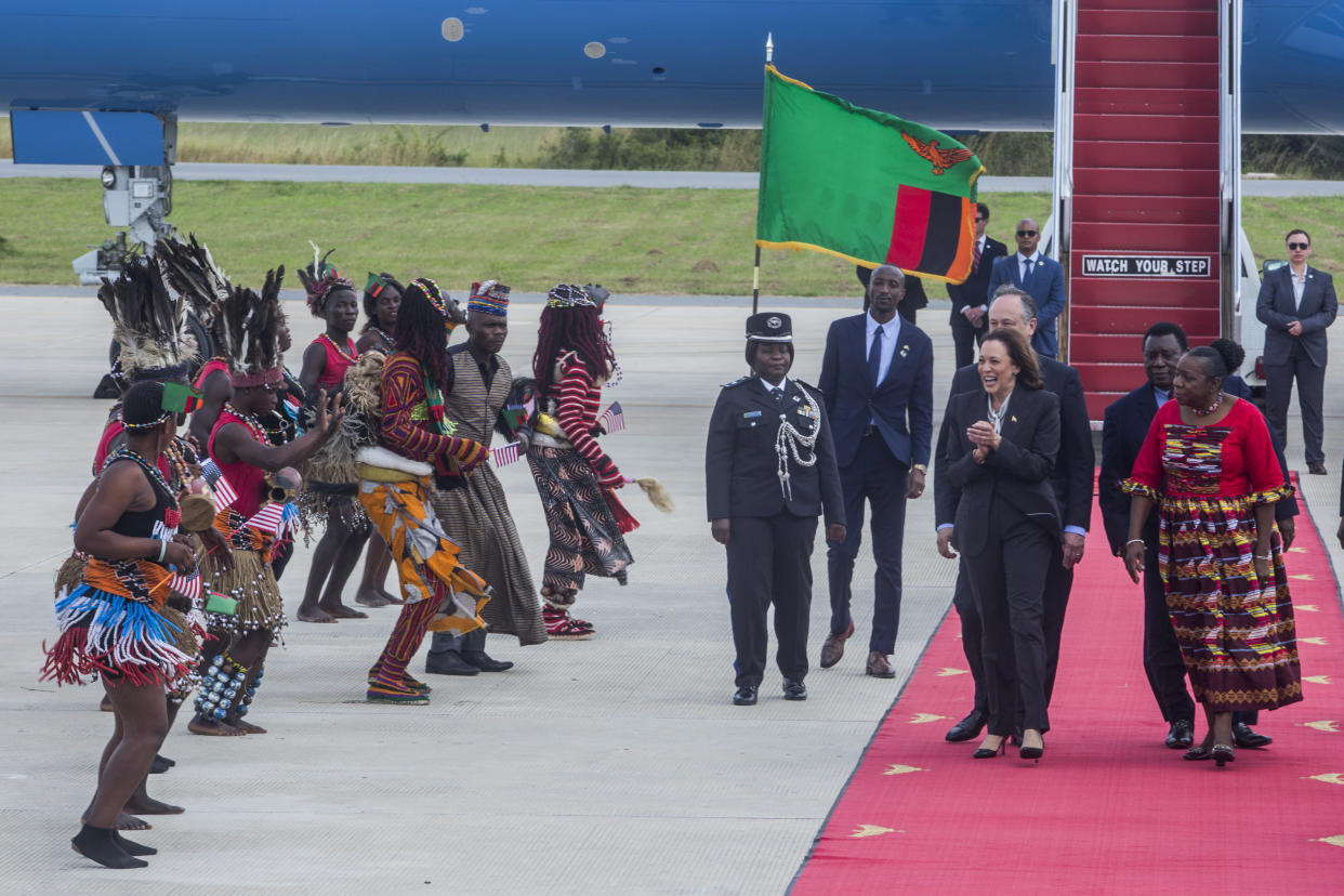 FILE - Vice President Kamala Harris, second right, is greeted by traditional dancers after landing in Lusaka, Zambia, Friday, March 31, 2023. Harris is poised to play a critical role in next year's election as President Joe Biden seeks a second term. (AP Photo/Salim Dawood, File)
