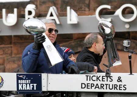 Feb 4, 2015; Boston, MA, USA; New England Patriots owner Robert Kraft (left) and president Jonathan Kraft hold up the Vince Lombardi Trophies during the Super Bowl XLIX victory parade. Stew Milne-USA TODAY Sports