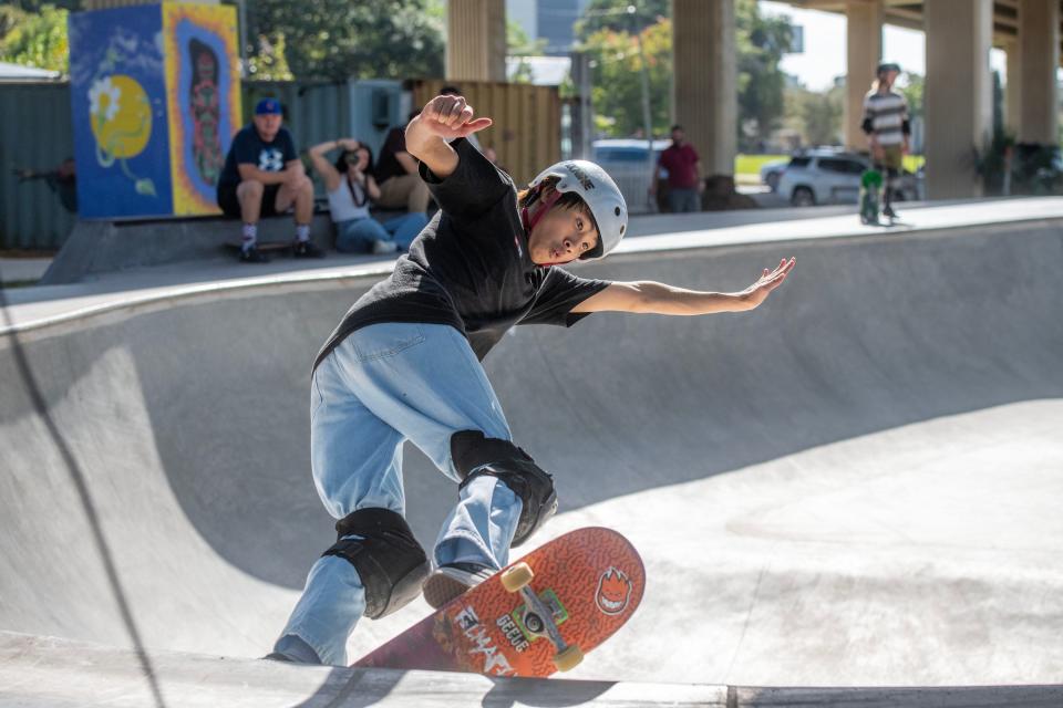 Skateboarders show off their skills during the Grind For Life skateboard competition at the Blake Doyle Skate Park in Downtown Pensacola Saturday, October 28, 2023. Grind For Life organization provides financial assistance to cancer patients and their families when traveling long distances to doctors and hospitals.