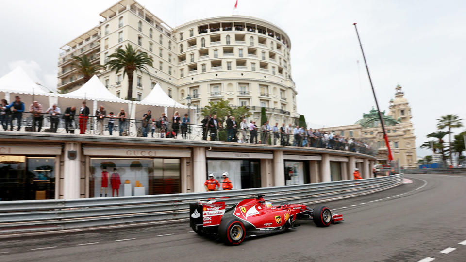 Pictured here, a Ferrari drives around the iconic course at the Monaco GP.