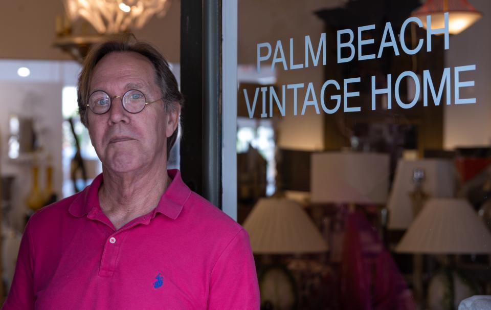 John Finger, owner of Palm Beach Vintage Home on Antique Row, poses for a picture inside his business on Wednesday, February 1, 2023, in West Palm Beach, FL. The storied Antique Row in West Palm Beach says it won't participate in a Palm Beach County Historical Society event on the street in front of its shops after it was cut out of planning last year and competing vendors set up booths in front of their doors.