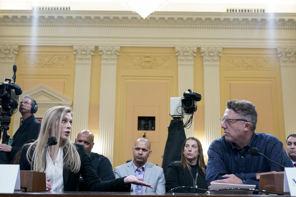 U.S. Capitol Police officer Caroline Edwards, left, speaks as British filmmaker Nick Quested, right, listens during a public hearing of the House select committee investigating the Jan. 6 attack on Capitol Hill, Thursday, June 9, 2022, in Washington. (AP Photo/Andrew Harnik)