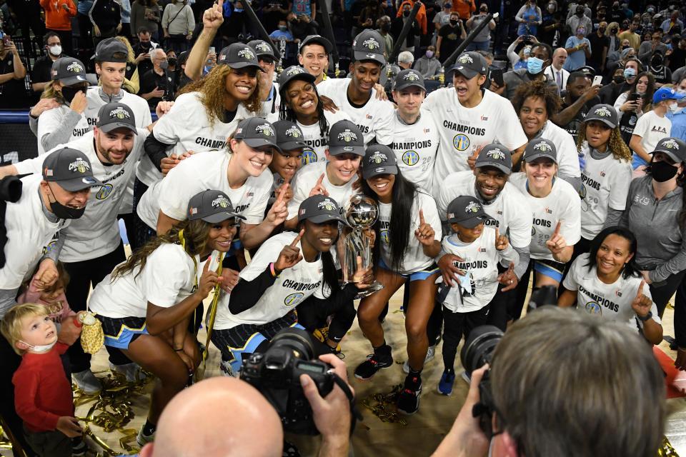 The Chicago Sky team with the championship trophy after beating the Phoenix Mercury 80-74 in Game 4 of the 2021 WNBA Finals.