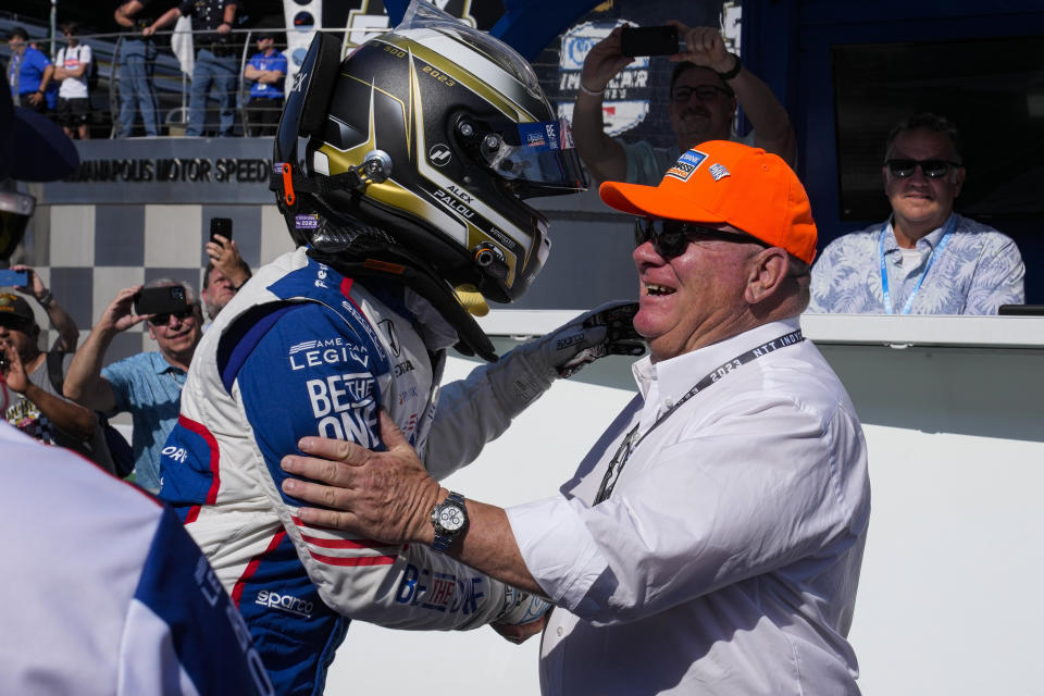 Alex Palou, of Spain, celebrates with car owner Chip Ganassi during qualifications for the Indianapolis 500 auto race at Indianapolis Motor Speedway in Indianapolis, Sunday, May 21, 2023. Palou won the pole for the race. (AP Photo/Michael Conroy)