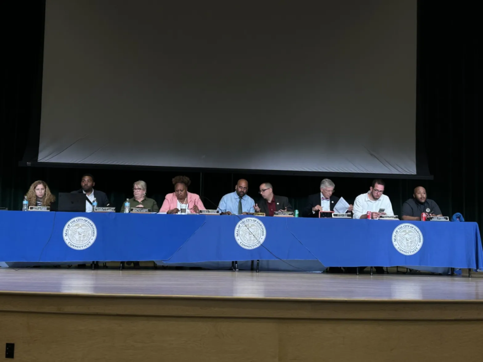 Dozens of Hartford residents protested and spoke at a city council meeting in early May in support of more funding for the local school district. (Jessika Harkay/CT Mirror)