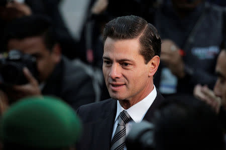 Mexican President Enrique Pena Nieto attends a flag-raising ceremony honouring the victims of the September 1985 and 2017 earthquakes at Zocalo square in Mexico City, Mexico September 19, 2018. REUTERS/Daniel Becerril/Files