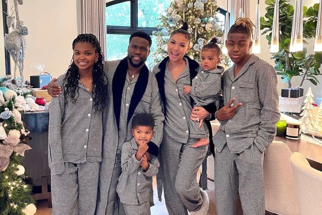 <p>courtesy Dr. Christmas</p> Kevin Hart and his family with their trees decorated by Dr. Christmas