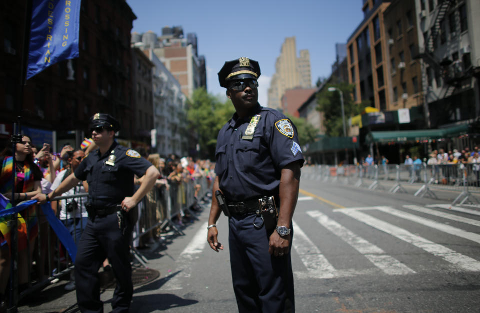 <p>An NYPD officer stands watch on Seventh Avenue during the annual Pride Parade on June 24, 2018 in New York City. (Photo: Kena Betancur/Getty Images) </p>