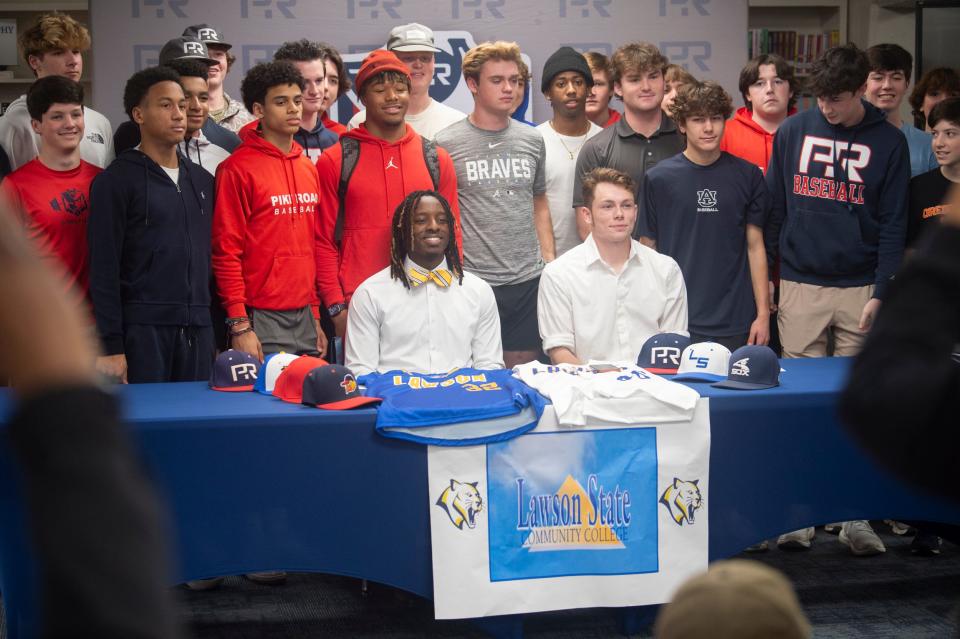 Pike Road baseball’s Chase Bass, left, and Jack Revis pose for photos after signing with Lawson State Community College at Pike Road High School in Pike Road, Ala., on Thursday, Jan. 25, 2024.