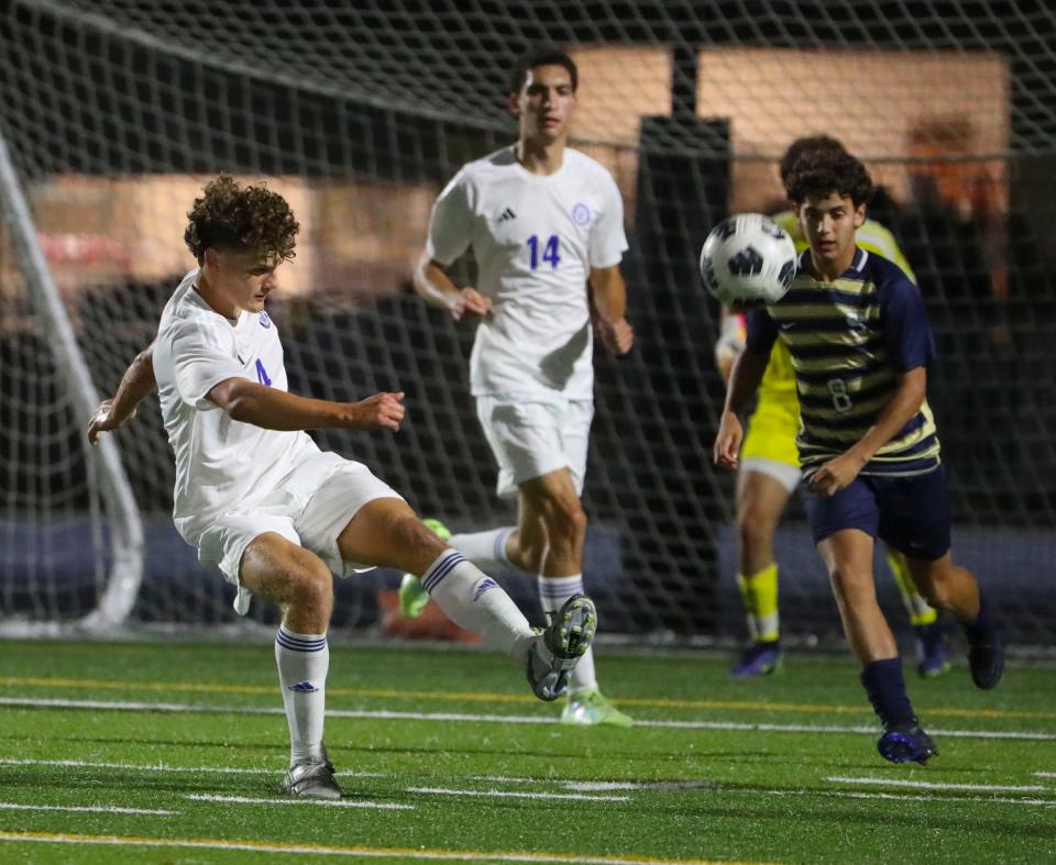 Charter School of Wilmington's Gavin Newcombe clears the ball away from teammate Dominick Tweed (14) and Salesianum's Aiden Dietrich in the first half of Salesianum's 2-0 win at Abessinio Stadium, Tuesday, Sept. 19, 2023.