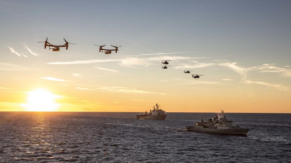 U.S. Navy and U.S. Marine Corps aircraft fly over the Portuguese Navy Vasco da Gama-class NRP Core-Real (F332), right, and U.S. Navy Whidbey Island-class dock landing ship USS Gunston Hall (LSD 44) during a maneuvering exercise in the Baltic Sea, Sept. 4, 2022. (MC1 John Bellino/US Navy)