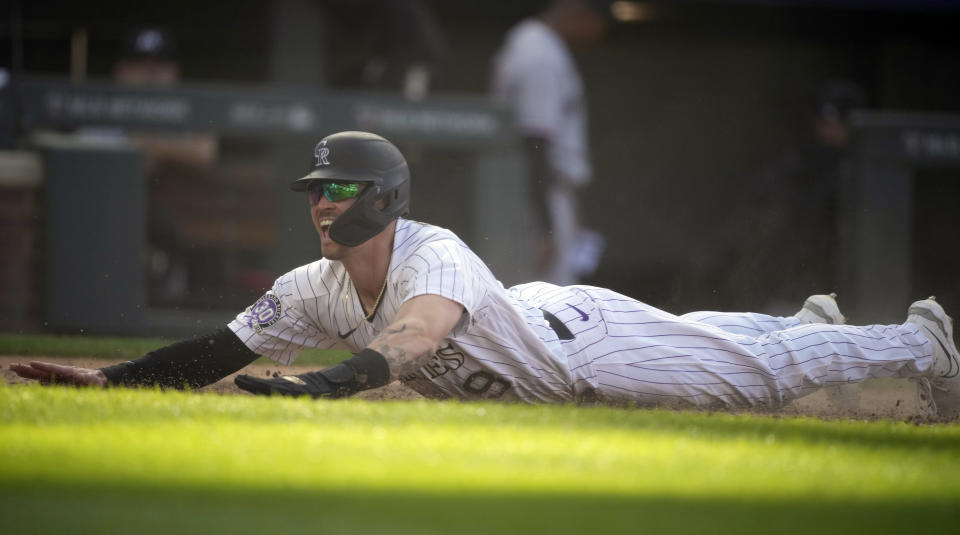 Colorado Rockies' Brenton Doyle reacts after scoring the winning run on a wild pitch by Minnesota Twins relief pitcher Jordan Luplow in the 11th inning of a baseball game Sunday, Oct. 1, 2023, in Denver. (AP Photo/David Zalubowski)