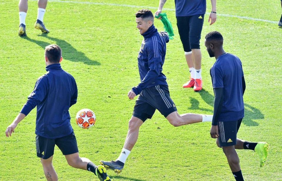 Juventus' Cristiano Ronaldo goes for the ball during Juventus' training session ahead of Wednesday's Champions League soccer match against Atletico Madrid, in Turin, Tuesday, Feb. 19, 2019. (Alessandro Di Marco/ANSA via AP)