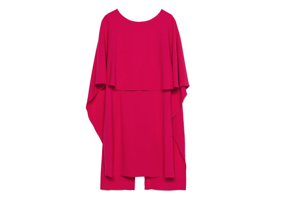 Business in the front, party in the back: You’re guaranteed to turn heads in this hot pink backless cape dress. 