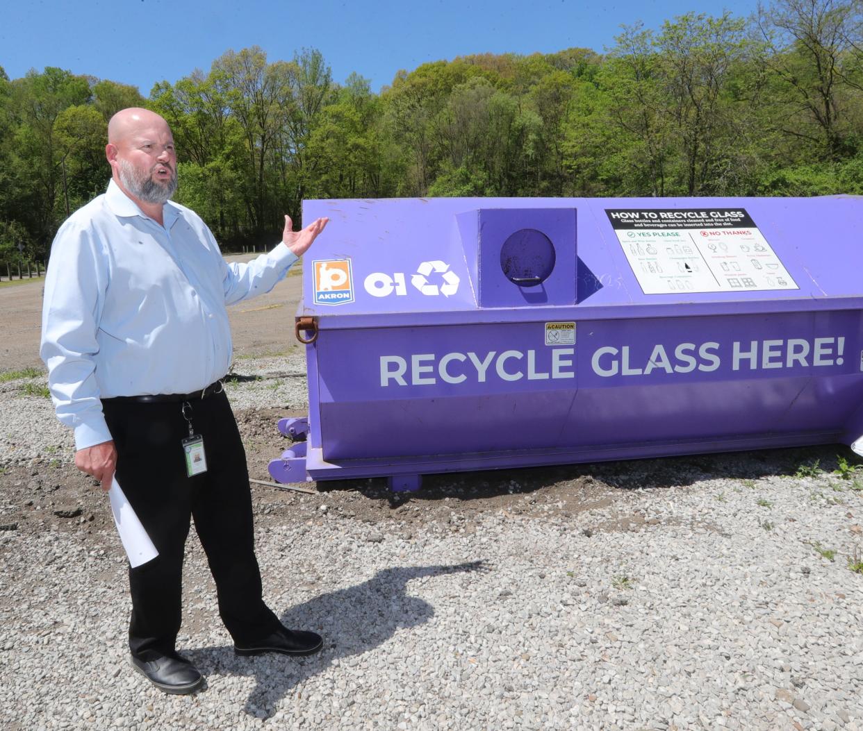 Akron Interim Public Works Bureau Manager Anthony Dolly talks about the city's glass recycling program while at the Akron dog park at 499 Memorial Parkway, where one of five bins throughout the city is located.