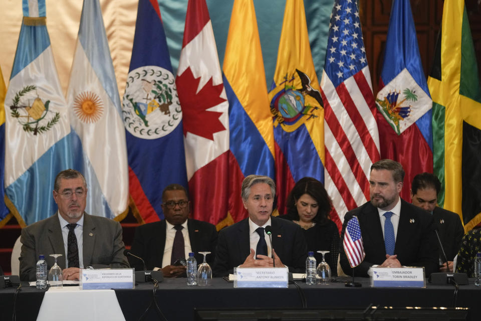 U.S. Secretary of State Antony Blinken addresses a regional meeting on irregular migration, next to Guatemalan President Bernardo Arevalo, left, and U.S. Ambassador Tobin Bradley, right, at the National Palace in Guatemala City, Tuesday, May 7, 2024. Blinken is in Guatemala for a two-day visit. (AP Photo/Moises Castillo)