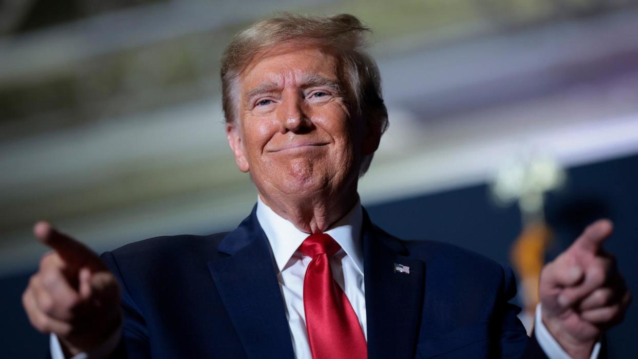 PHOTO: Republican presidential candidate and former U.S. President Donald Trump gestures to supporters after speaking at a Get Out The Vote rally at the North Charleston Convention Center, Feb. 14, 2024, in North Charleston, S.C. (Win Mcnamee/Getty Images)