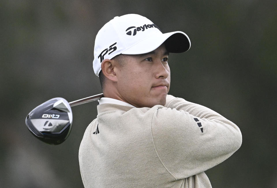 Collin Morikawa watches his tee shot on the 11th hole of the North Course at Torrey Pines during the first round of the Farmers Insurance Open golf tournament, Wednesday, Jan. 24, 2024, in San Diego. (AP Photo/Denis Poroy)