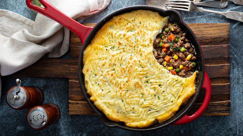 Shepherd's pie in skillet on cutting board