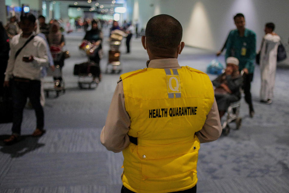 TANGERANG, INDONESIA - MAY 15: A health officer stands waiting passenger to detect a monkeypox virus at Soekarno-Hatta International Airport in Tangerang near Jakarta, Indonesia on May 15, 2019. Monkeypox is an infectious disease by monkeypox virus endemic from parts of Central and Westerns Africa that make humans lesions, fever, muscle aches and chills. (Photo credit should read Jepayona Delita/Future Publishing via Getty Images)