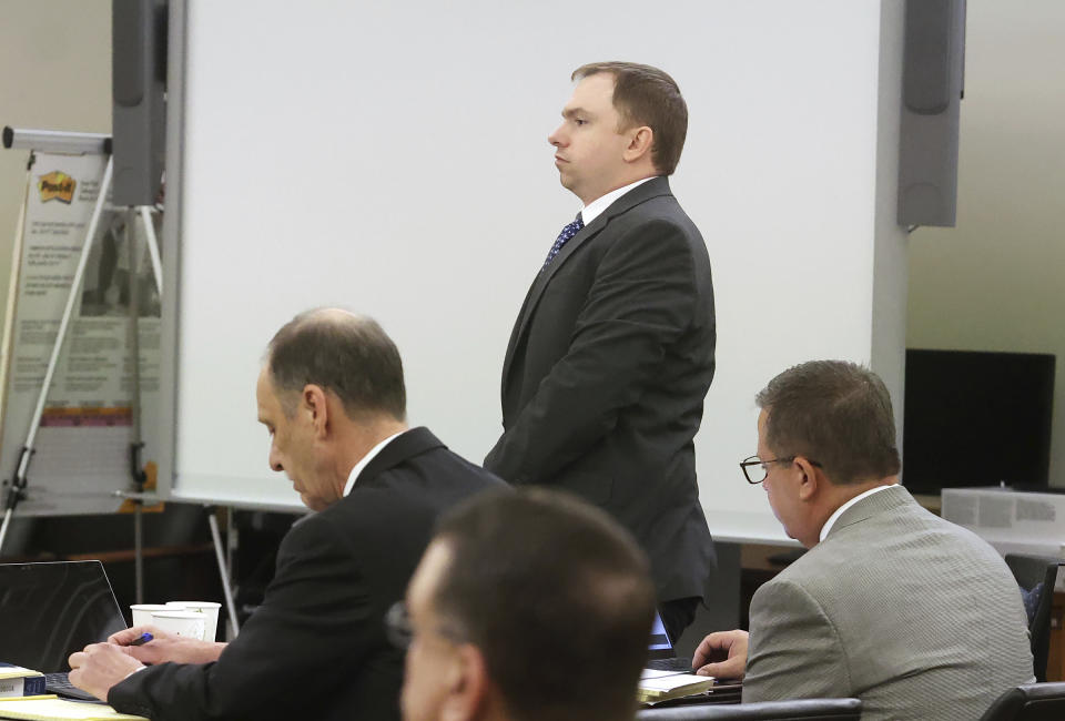 Aaron Dean stands for the beginning of the sentencing phase of his trial at Tarrant County's 396th District Court on Friday, Dec. 16, 2022, in Fort Worth, Texas. Dean, a former Fort Worth police officer, was found guilty of manslaughter in the 2019 shooting death of Atatiana Jefferson. (Amanda McCoy/Star-Telegram via AP, Pool)