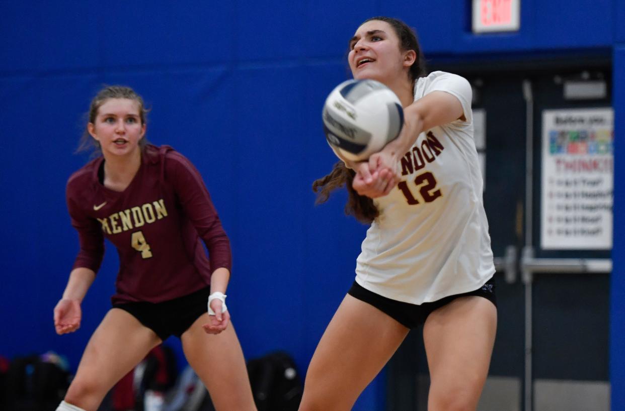 Pittsford Mendon's Sarah Gestring, right, passes the ball as Ava Mae McHarg looks on during a regular season game against Irondequoit, Friday, Sept. 22, 2023.