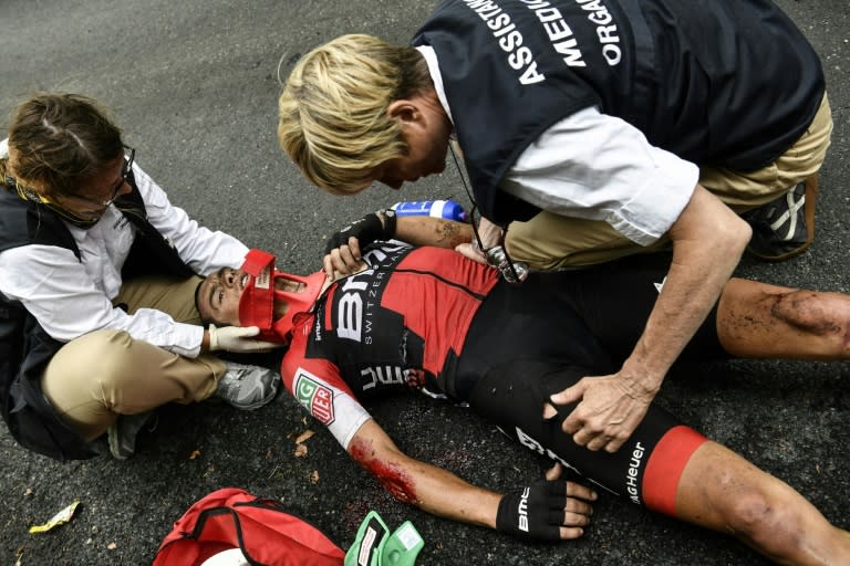 Australia's Richie Porte receives medical assistance after falling during the 181,5km 9th stage of the 104th edition of the Tour de France cycling race, between Nantua and Chambery, on July 9, 2017