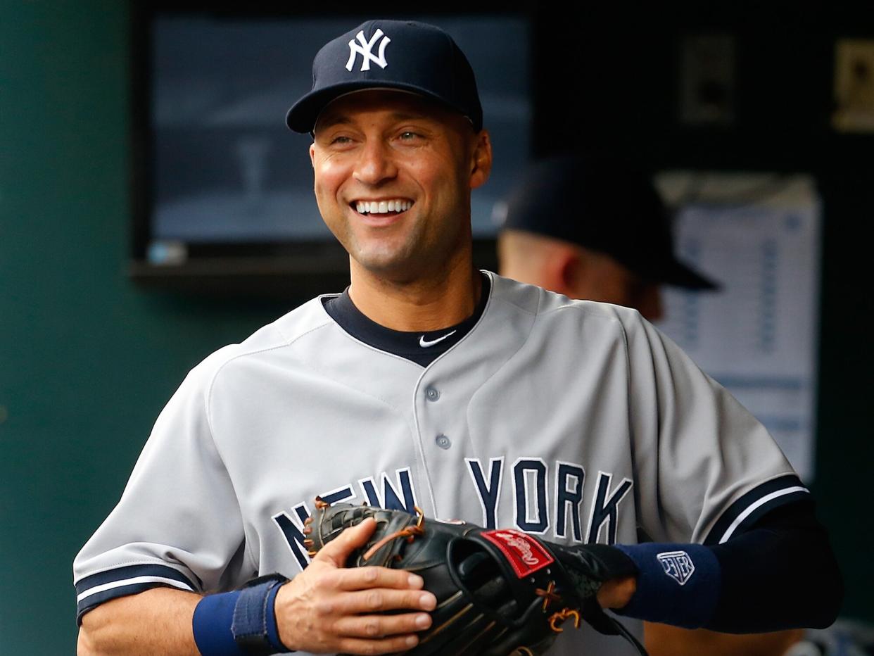 Derek Jeter #2 of the New York Yankees looks on from the dugout prior to the game against the New York Mets on May 15, 2014 at Citi Field in the Flushing neighborhood of the Queens borough of New York City. Yankees defeated the Mets 1-0