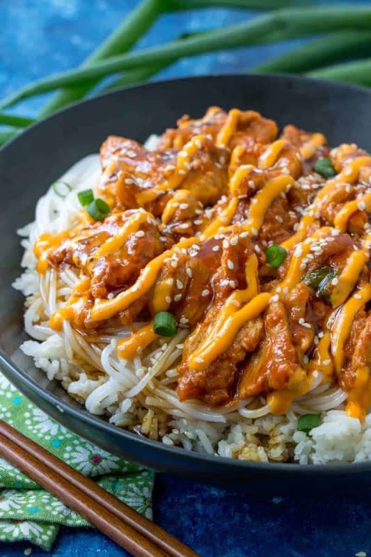 <p>Tournadough Alli</p><p>These Korean spicy pork bowls are filled with a marinated pork, rice, noodles and drizzled in sriracha mayo, teriyaki sauce and sesame seeds. A fun unique and flavorful dish!</p><p><strong>Get the recipe: <a href="https://tornadoughalli.com/korean-spicy-pork-bowls/" rel="nofollow noopener" target="_blank" data-ylk="slk:Korean Spicy Pork Bowls;elm:context_link;itc:0;sec:content-canvas" class="link ">Korean Spicy Pork Bowls</a></strong></p>