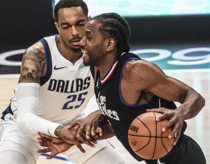 Los Angeles, CA, Tuesday, April 23, 2024 - LA Clippers forward Kawhi Leonard (2) dribbles past Dallas Mavericks forward P.J. Washington (25) during first Hal action in game two of the NBA Western Conference playoffs at Crypto.Com Arena. (Robert Gauthier/Los Angeles Times)