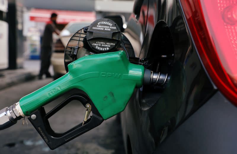 A car is being filled with fuel at a gas station in Beirut