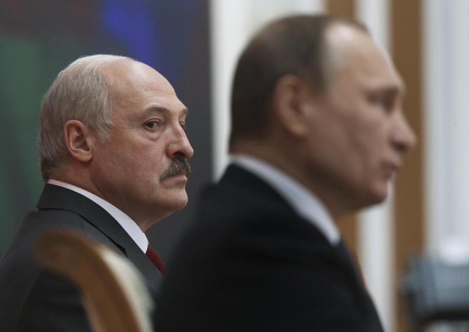 FILE - In this Thursday, Feb. 25, 2016 file photo, Belarusian President Alexander Lukashenko, left, and Russian President Vladimir Putin attend the talks in Minsk, Belarus. In more than two decades in power, the autocratic leader of Belarus has cast his nation as Moscow's closest ally, securing tens of billions of dollars in Russian subsidies. Now, the Kremlin finally seems to have lost patience with its unruly ally. (Yekaterina Shtukina/Pool Photo via AP, File)