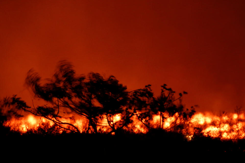 <p>In a long-exposure photograph, lava flows on the outskirts of Pahoa during ongoing eruptions of the Kilauea Volcano in Hawaii, June 6, 2018. (Photo: Terray Sylvester/Reuters) </p>