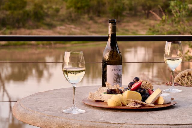 <p>Mark Williams/Courtesy of The Royal Portfolio</p> Wine and charcuterie board at Waterside Lodge at Royal Malewan