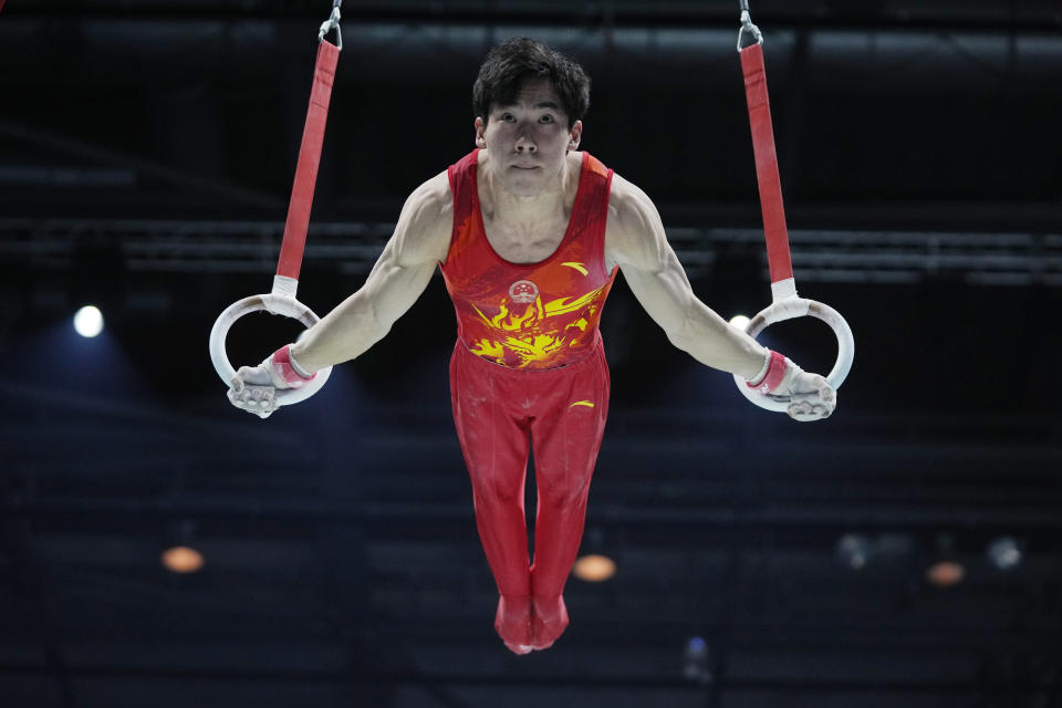 Boheng Zhang of China competes on the rings at the Men's All-Around Final during the Artistic Gymnastics World Championships at M&S Bank Arena in Liverpool, England, Friday, Nov. 4, 2022. (AP Photo/Thanassis Stavrakis)