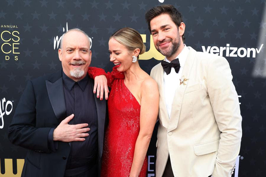 (Left to Right) Paul Giamatti, Emily Blunt and John Krasinski cut up at the 29th Annual Critics Choice Awards at Barker Hangar in Santa Monica, where Giamatti and Blunt took home top awards for “The Holdovers” and “Oppenheimer.” (Kevin Mazur/Getty Images for Critics Choice Association)