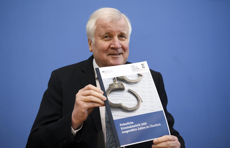 German Interior Minister Horst Seehofer presents the crime statistics report for 2020 during a news conference in Berlin, Germany, Thursday, April 15, 2021. (Annegret Hilse/Pool via AP)