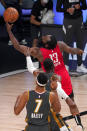 Oklahoma City Thunder's Darius Bazley (7) watches as Nerlens Noel attempts to stop Houston Rockets' James Harden (13) on a shot attempt during the second half of an NBA first-round playoff basketball game, Monday, Aug. 31, 2020, in Lake Buena Vista, Fla. (AP Photo/Mark J. Terrill)
